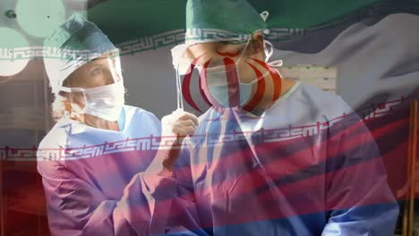 animation of flag of south iran waving over surgeons in operating theatre