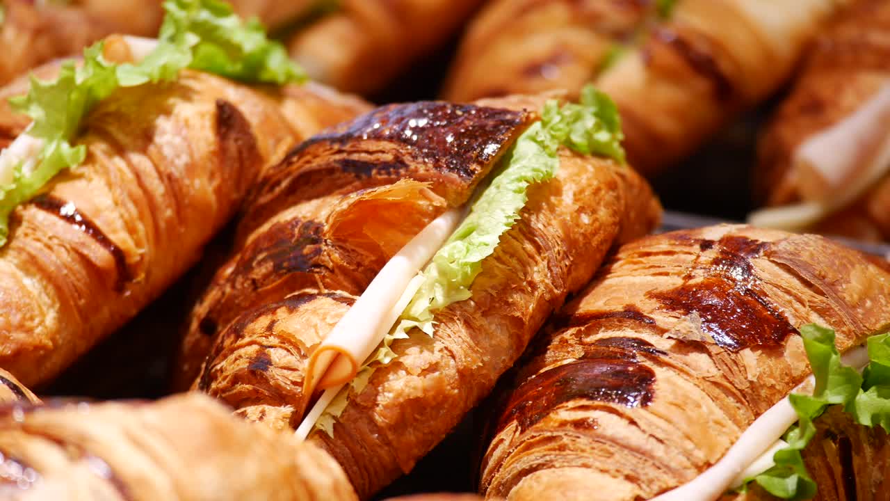 Close-up of Savory Croissant Sandwiches with Ham and Lettuce