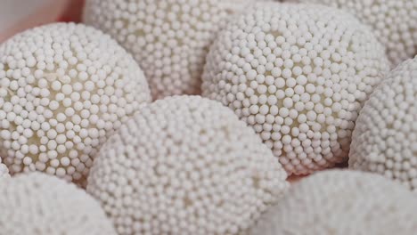 white confectionery balls with sprinkles