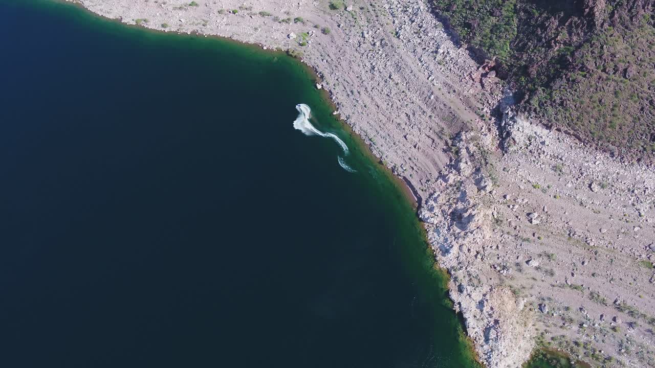 A high-flying drone shot over Lake Mead, a massive reservoir formed by the Hoover Dam on the Colorado River, that lies on the border of Arizona and Nevada, just east of Las Vegas