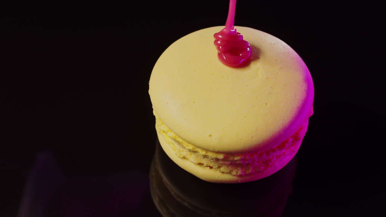 Close up of Yellow Macarons with Pink Lighting