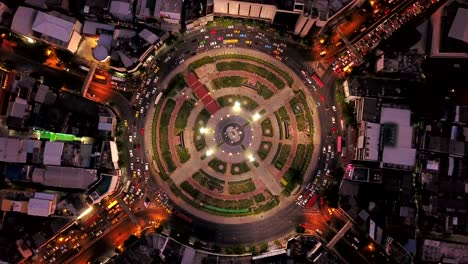 wongwian yai roundabout. aerial view of highway junctions. roads shape circle in structure of architecture and technology transportation concept. top view. urban city, bangkok at night, thailand.