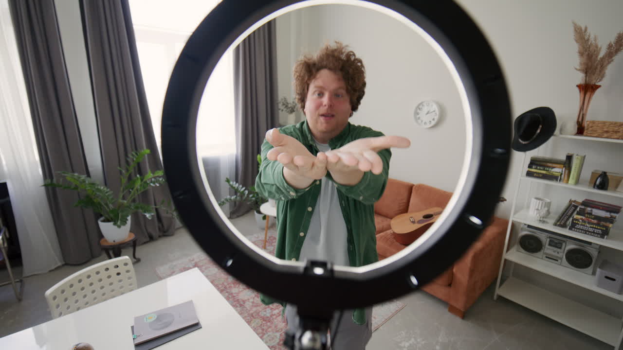 Cheerful Blogger Energetically Dancing and Singing on Camera at Home