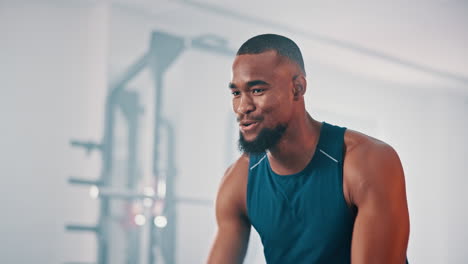 man working out in a gym using a cable machine