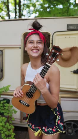 happy camper with ukulele