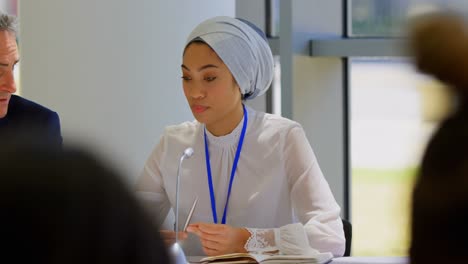 Multi-ethnic-business-people-attending-a-business-seminar-4k