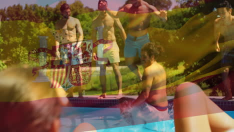 animation of flag of spain over happy caucasian friends having fun at swimming pool