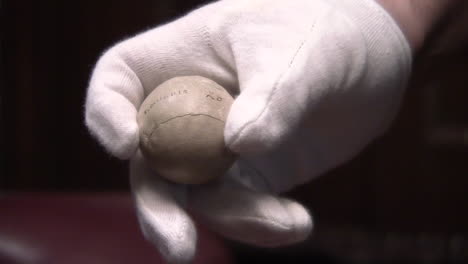 old leather golf ball, from the early days of sport, previously used in competition