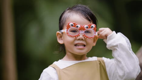 kid posing with glasses