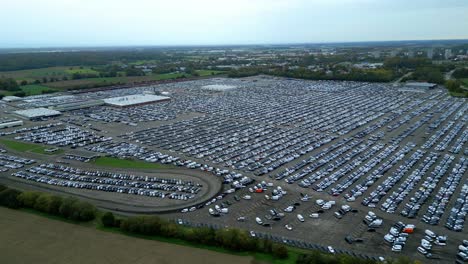 many cars on a parking lot from above, filmed with a drone in 4k, parked cars