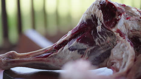 close-up of fresh lamb meat on wooden table. organic and sustainable butchery practices