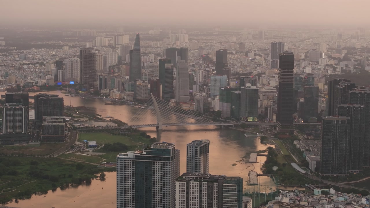Ho Chi Minh City, Vietnam, with its skyscrapers stretching along the riverbank at sunset | Ho Chi Minh City Skyline