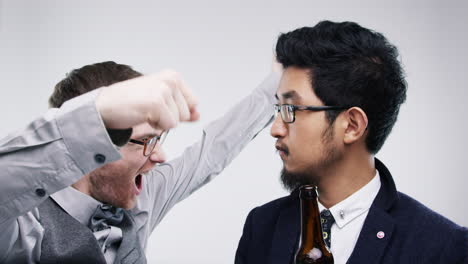 two men celebrating and arguing over a beer