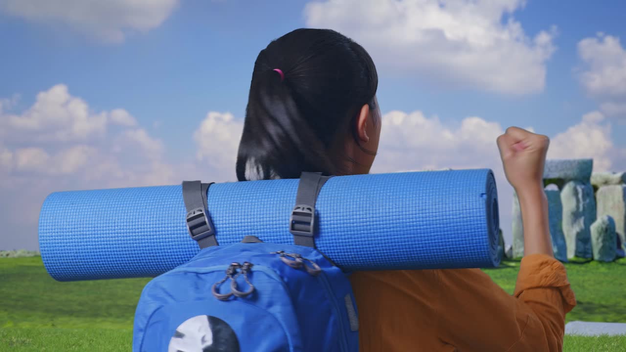 Close Up Back View Of A Female Hiker With Mountaineering Backpack Screaming Goal Celebrating The Success While Traveling In Stonehenge