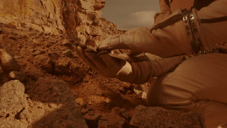 astronaut on mars collecting a sample