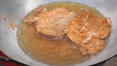 Close-Shot-of-Shrimp-Cakes-Frying-at-the-Side-of-the-Road