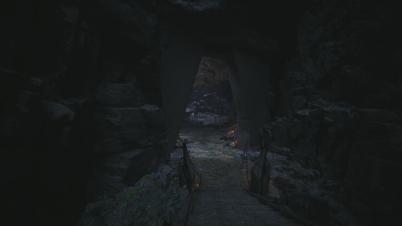Mysterious cave entrance surrounded by shadows and rocks at dusk