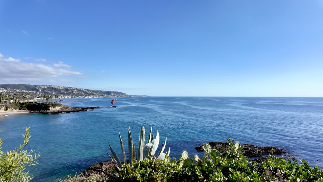 Scenic view of a hang glider enjoying a sunny day at Crescent Bay Park Point in Laguna Beach, California