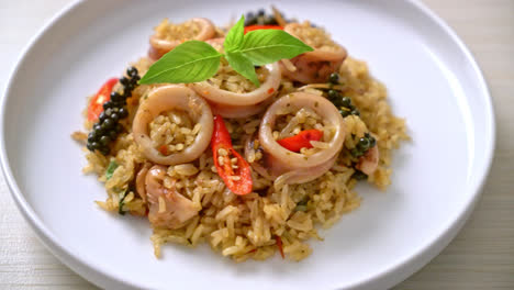 homemade basil and spicy herb fried rice with squid or octopus - asian food style