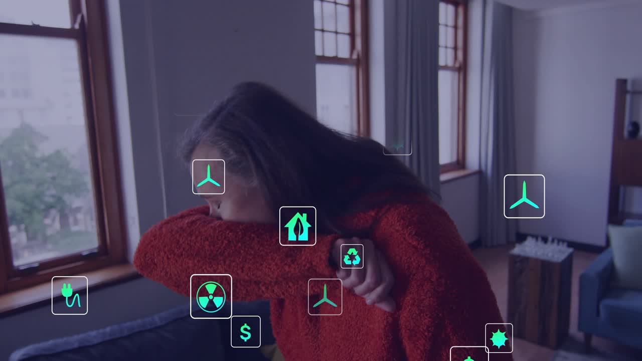 Mature woman picking smartphone on couch scrolling and causing eco tech icons floating around body