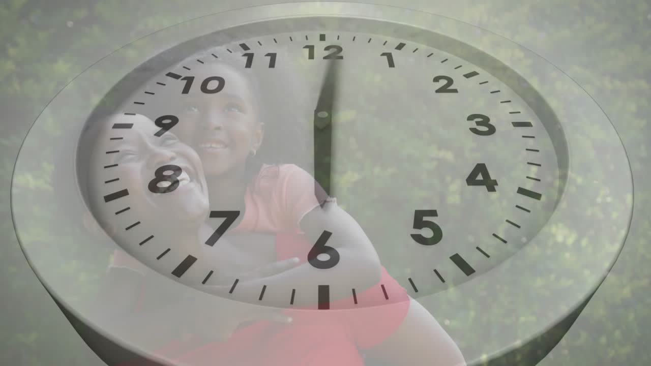 Mother carrying daughter in park while clock overlay fading rotating illustrating tech time-lapse