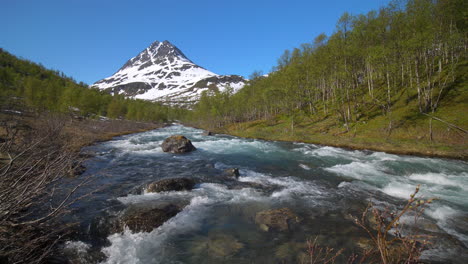 static view of rapids high up in the lyngen alps, sunny, summer day, in north norway