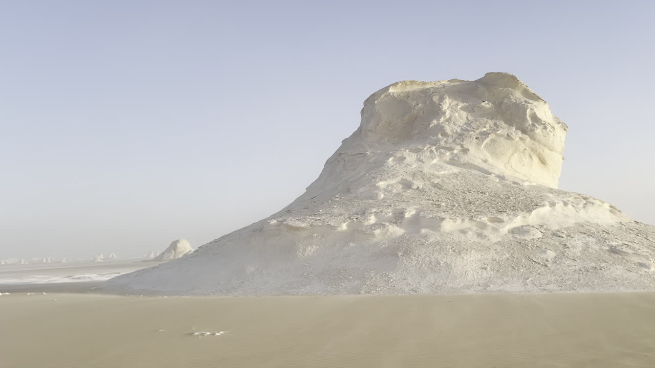 The Egyptian white desert adventure tourism with bedouin camping and 4x4 driving through the desert to see rock formation and sand and dust at sunset and golden hour