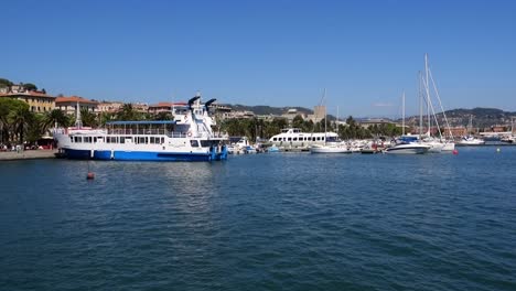 panoramic view of a tourist port and its boats in italy, on a sunny day