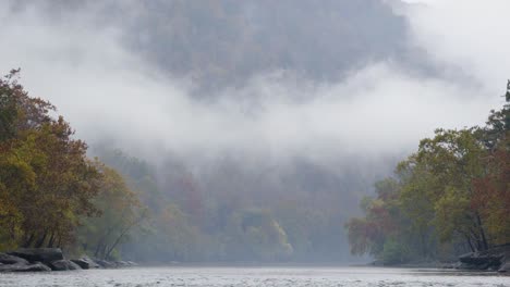 static shot of mist rising through the valley at the river gorge