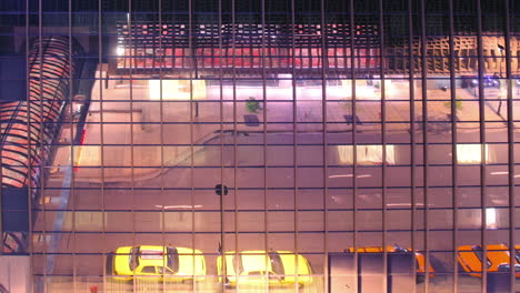 lights reflected in mirrored hotel building