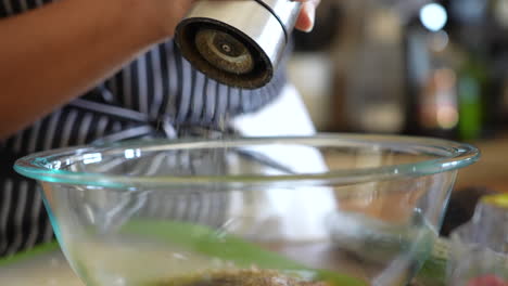 Grinding-pepper-into-a-homemade-salad-dressing---ANTIPASTO-SALAD-SERIES