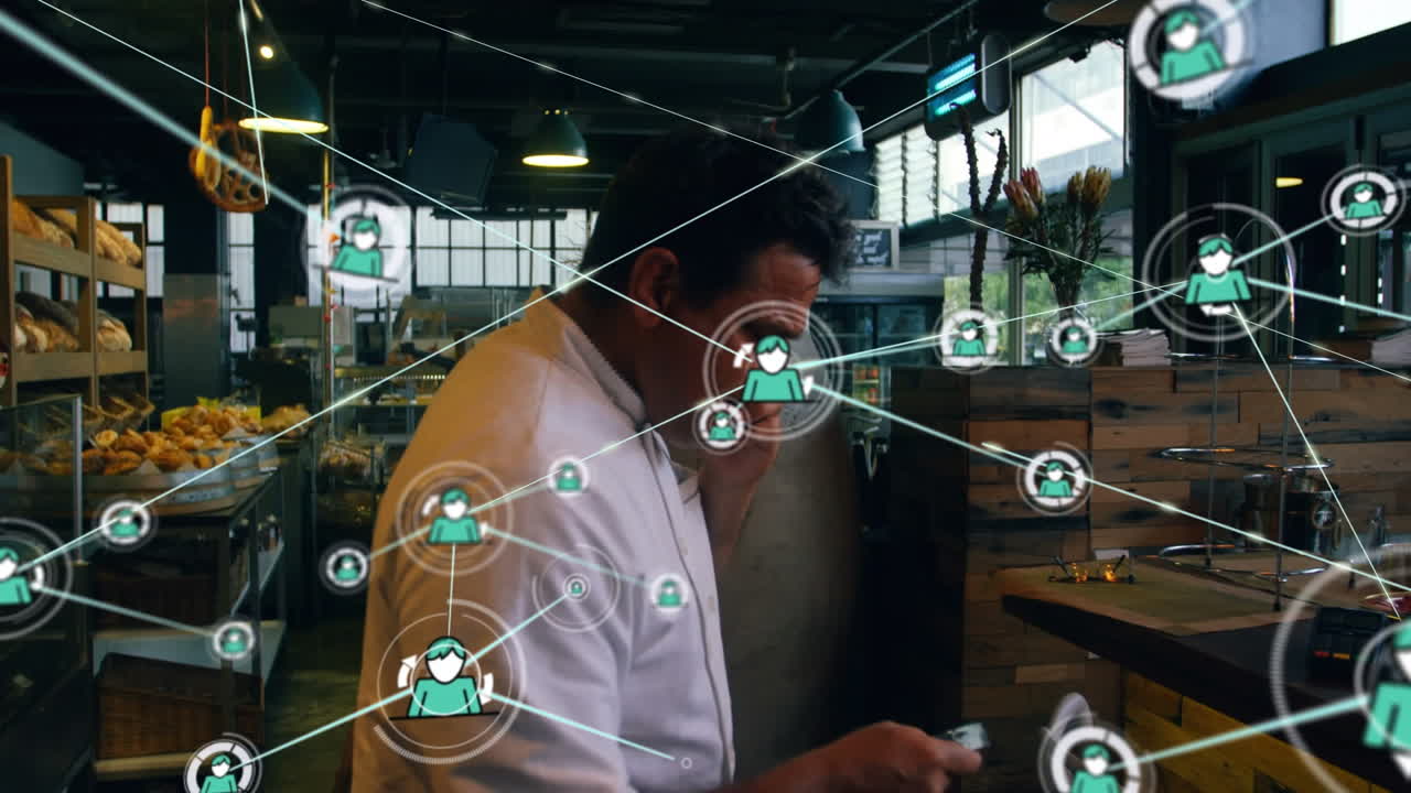 Animation of network of connections with people icons over biracial businessman using smartphone