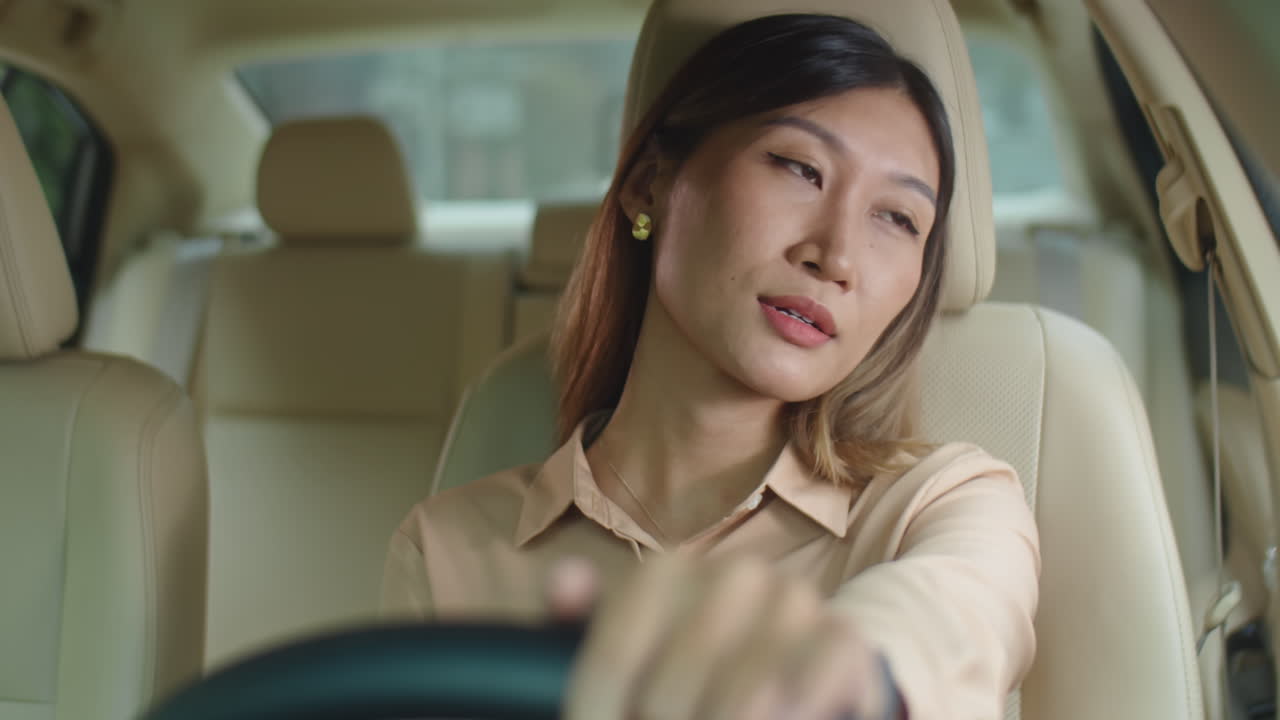 Tired Asian Businesswoman in Car