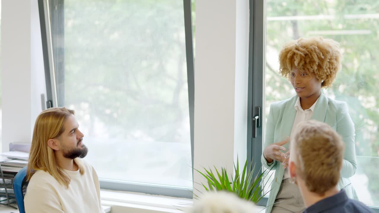 African manager talking during a business meeting in a coworking