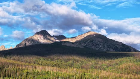 timelapse of buffalo mountain on a sunny day in silverthorne colorado with passing clouds aerial static