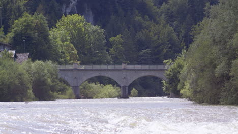 historic stone bridge over a picturesque river in sunshine