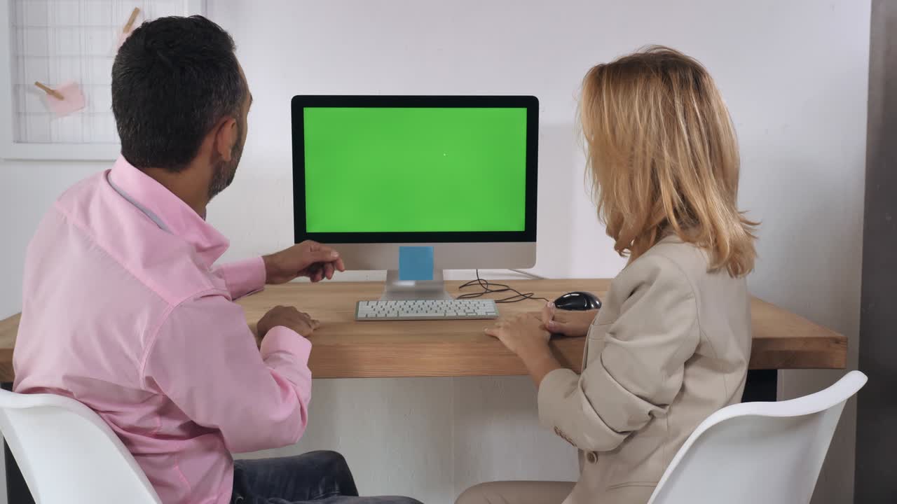 adult businessman and businesswoman in office