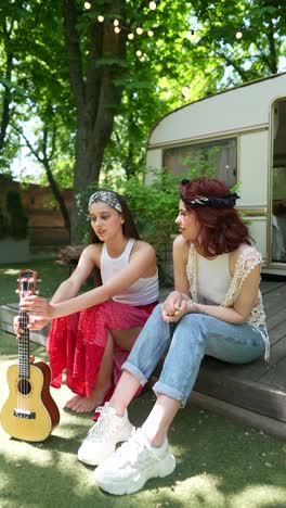 two friends relaxing in a garden with ukulele