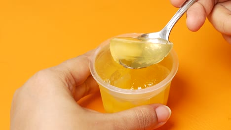 spoon pick ful orange flavor jelly