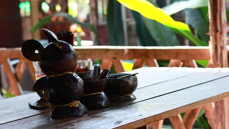 coconut shell condiments on a wooden table