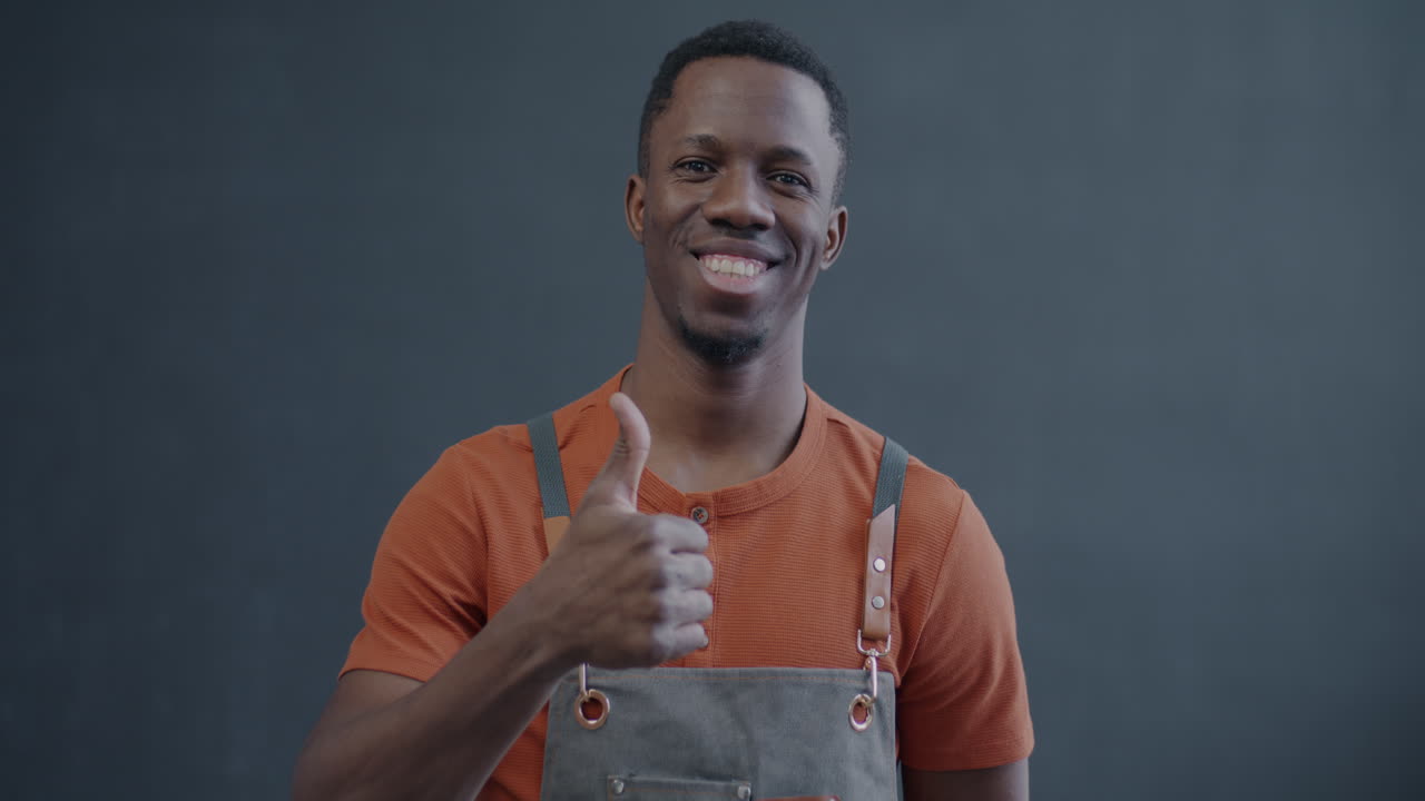 Happy Employee Giving Thumbs Up