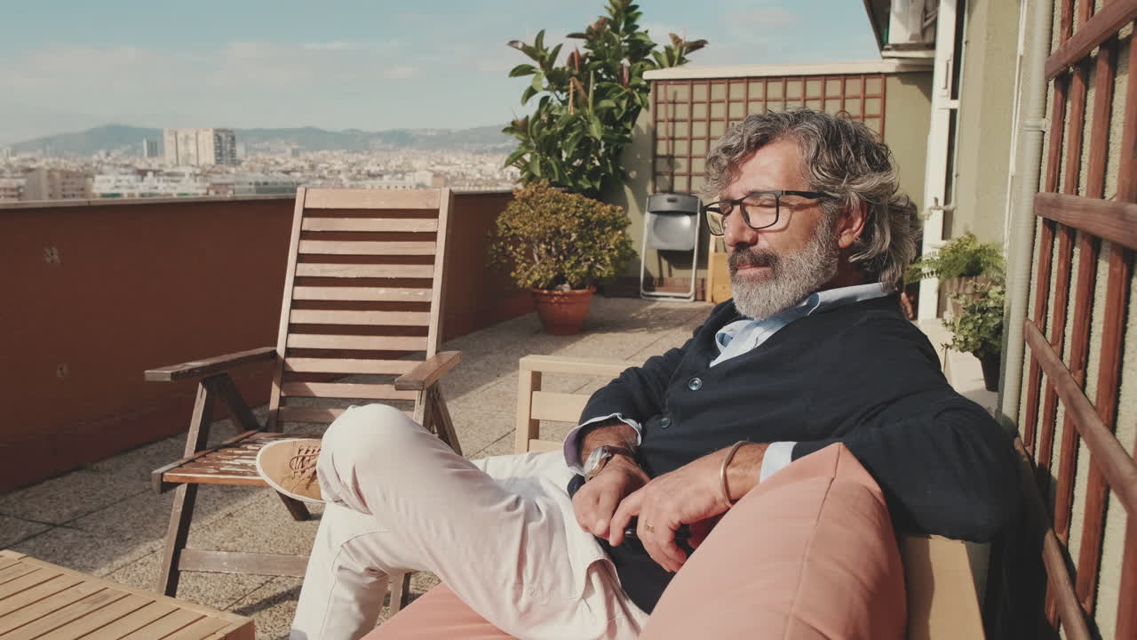 Man Relaxing on a Rooftop Terrace