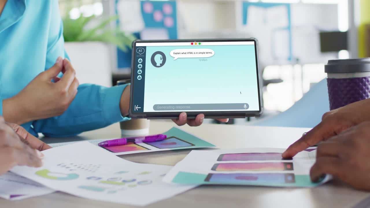 Diverse business people using tablet with digital chat on screen in office