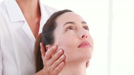 Physiotherapist-doing-head-massage-to-her-patient