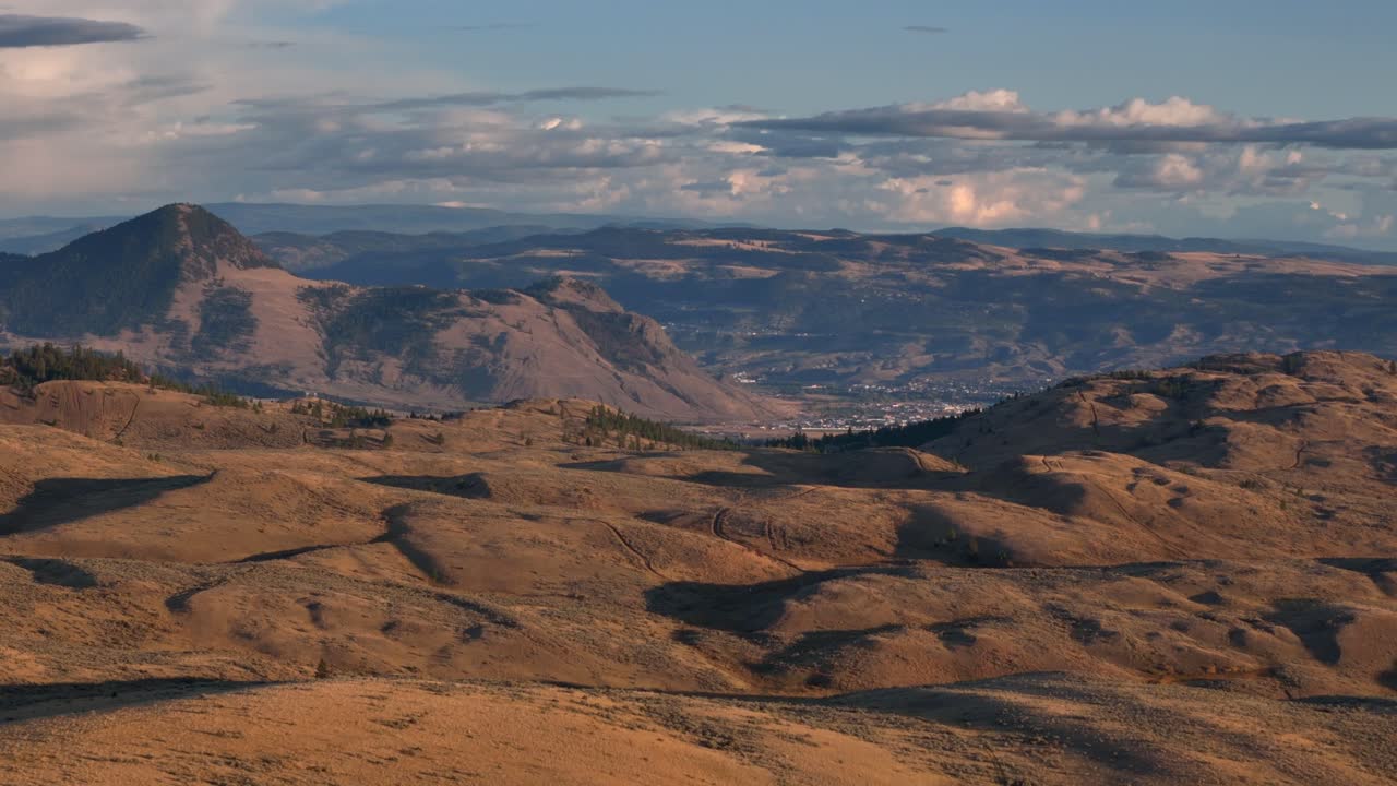 Nature's Evening Canvas: Aerial View of Sunset on the Grassland and Hills