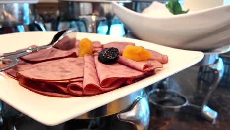 breakfast buffet ham and fruit display