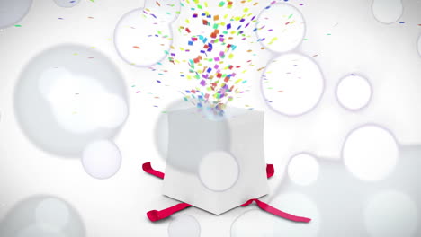 confetti and bubbles animation over white gift box with red ribbons