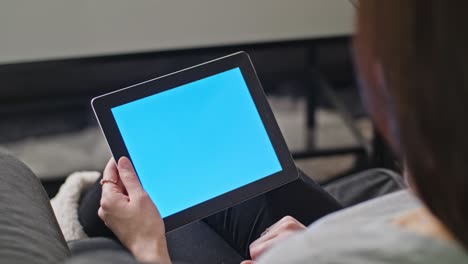 girl using digital tablet pc with blue screen