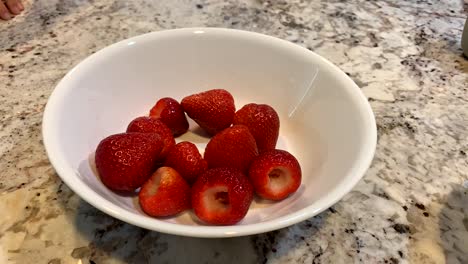 a bowl of fresh clean strawberries gone in 5 seconds