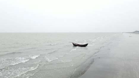 wooden fishing boat isolated on tropical sea with calm waves